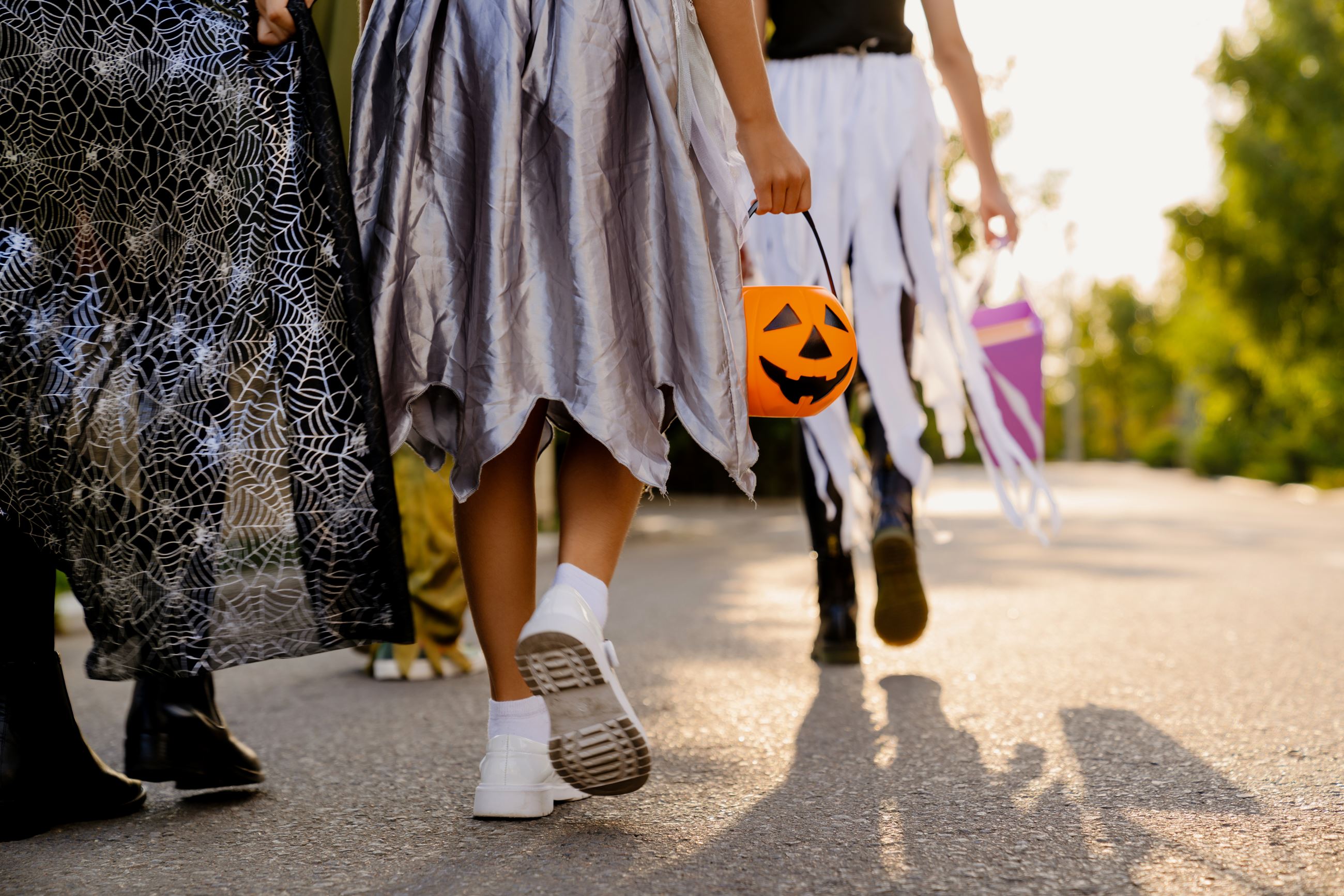 children-walking-down-street-during-trick-or-2022-01-18-23-50-57-utc