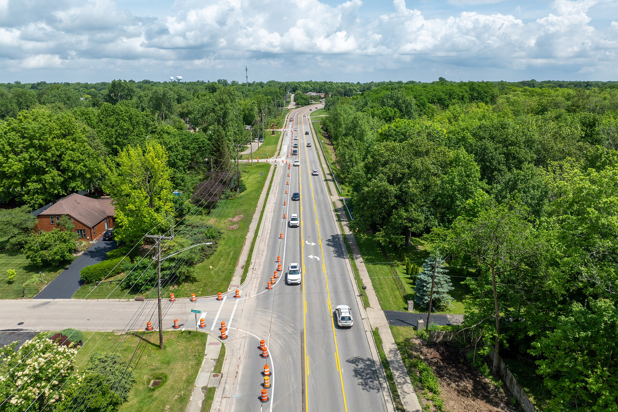 Portion of North Fairfield Road with construction barrels lining one side