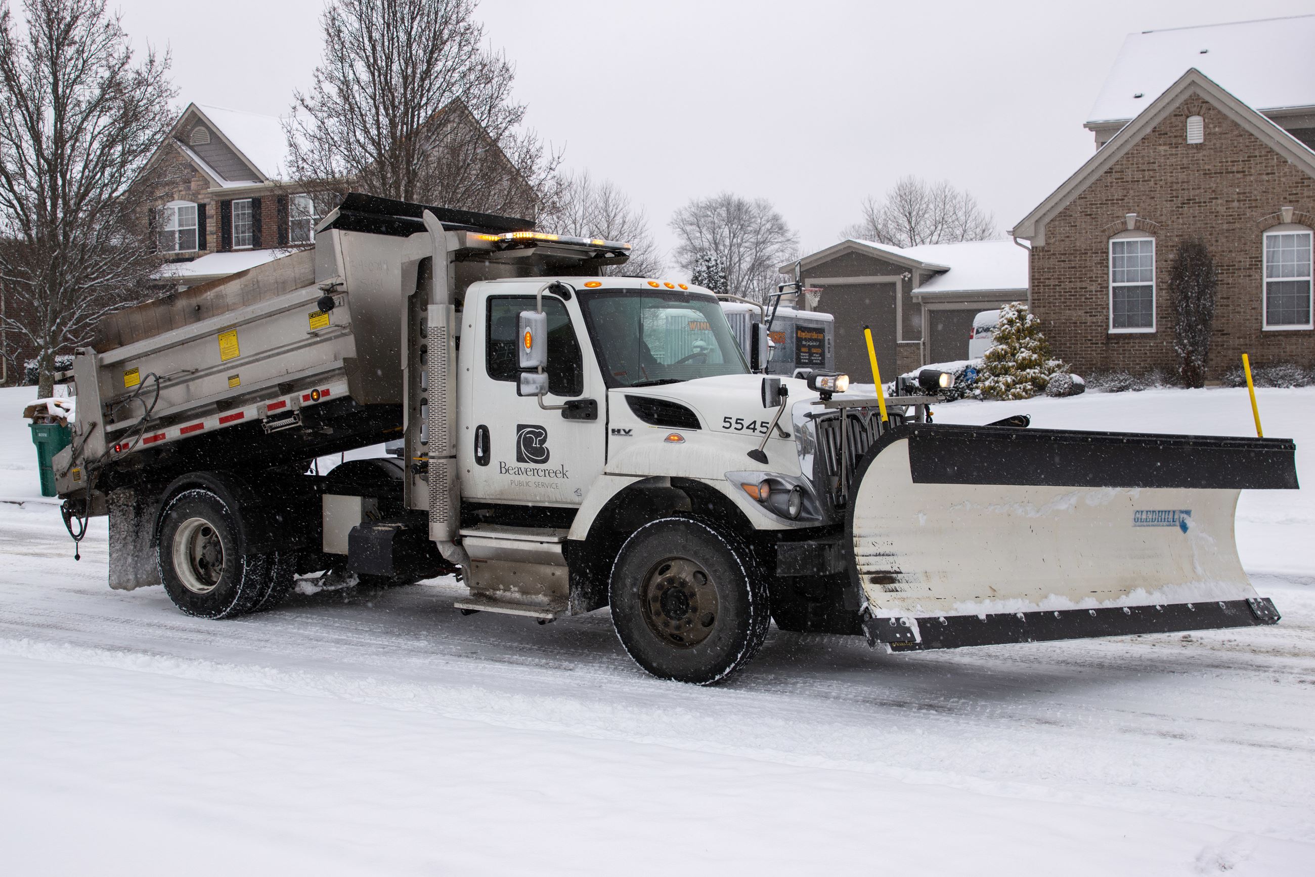Beavercreek snow plow clearing neighborhood roadway 